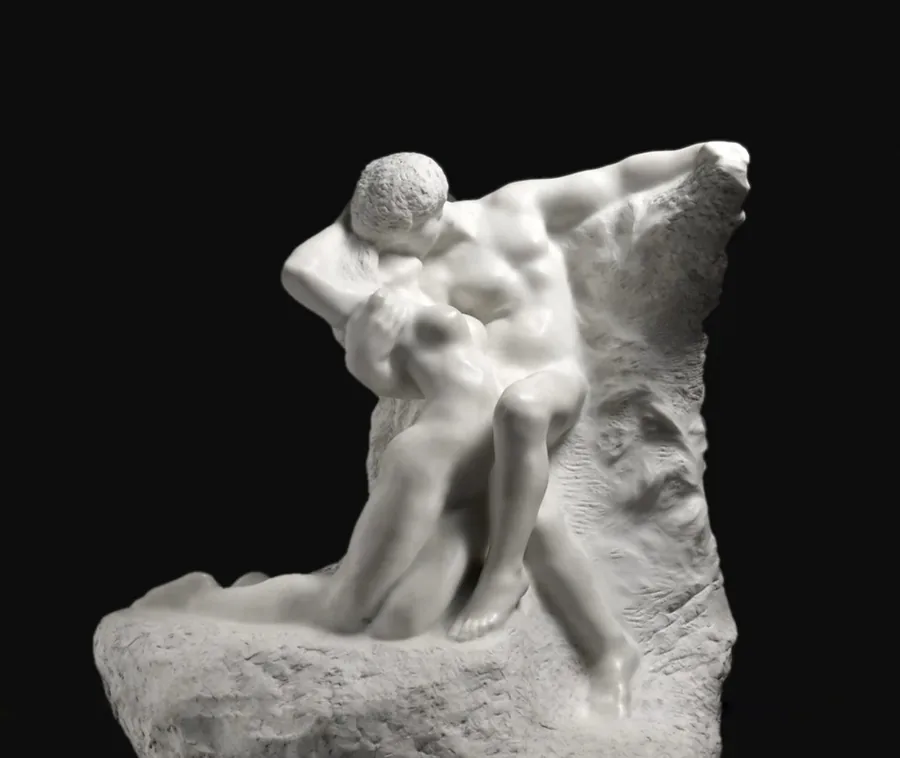 Marble group by Auguste Rodin: two figures half-emerged from rough stone.